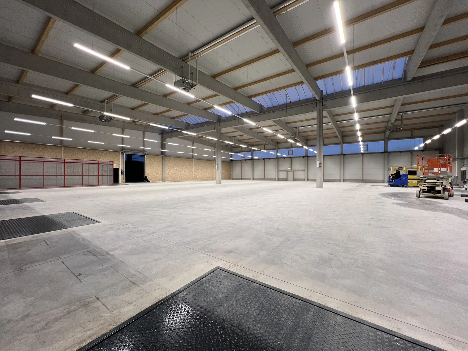 Large industrial hall with extensive linear lighting installation